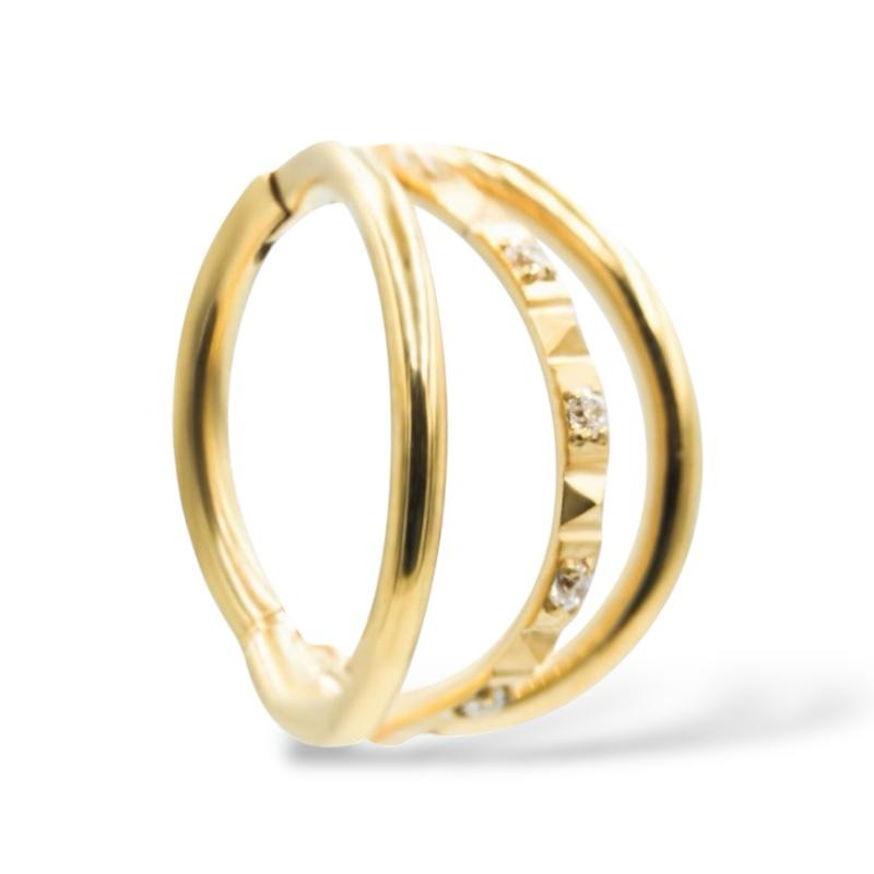 Dreifacher Klicker aus Gold und Titan mit Zirkonia